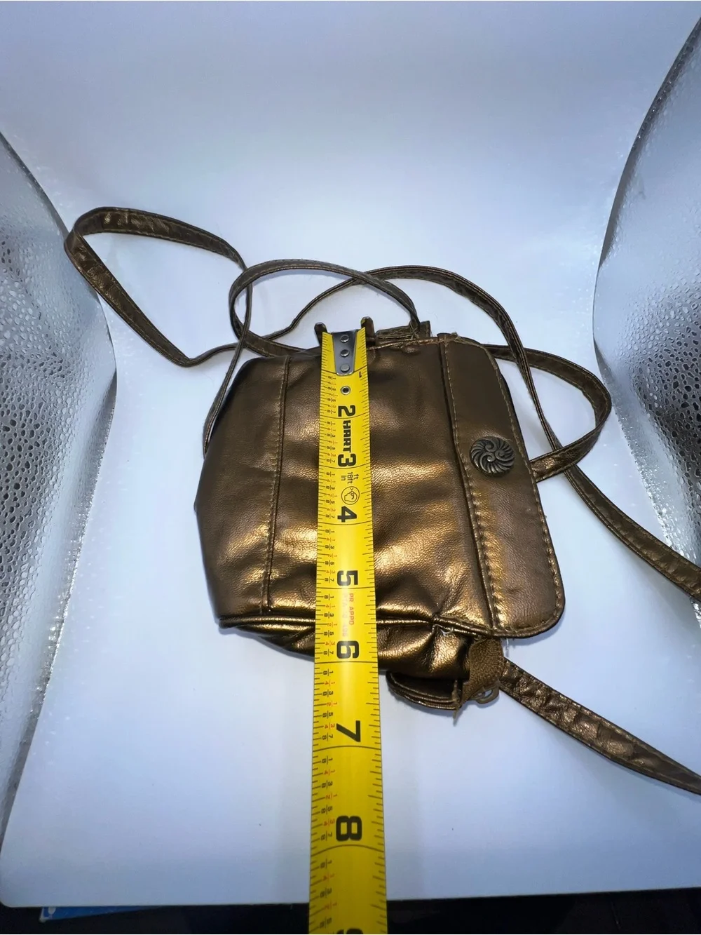 Vintage metallic bronze crossbody purse manufactured by the brand Beverly Hills